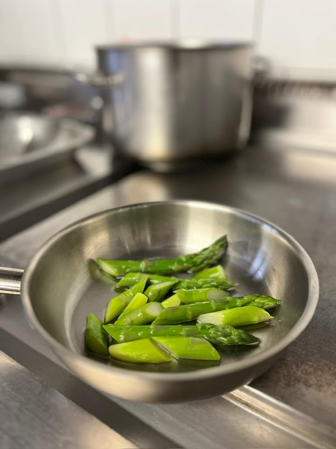 Fresh asparagus cooking in the kitchen of La Livrée